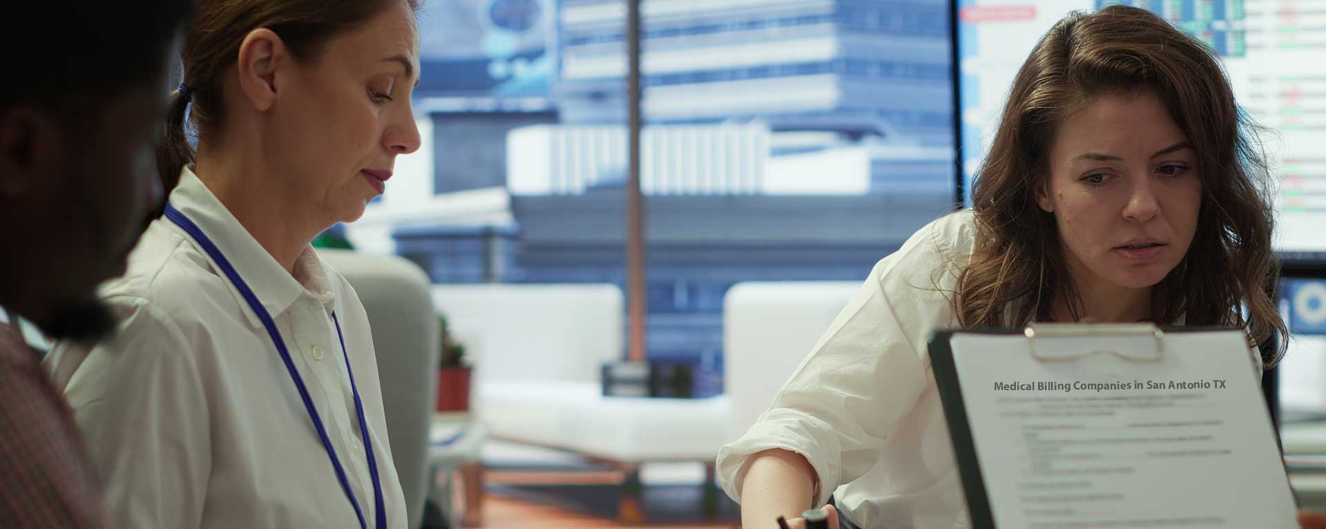 Medical billing professionals reviewing documents in an office, representing compliance-focused billing in New Jersey.